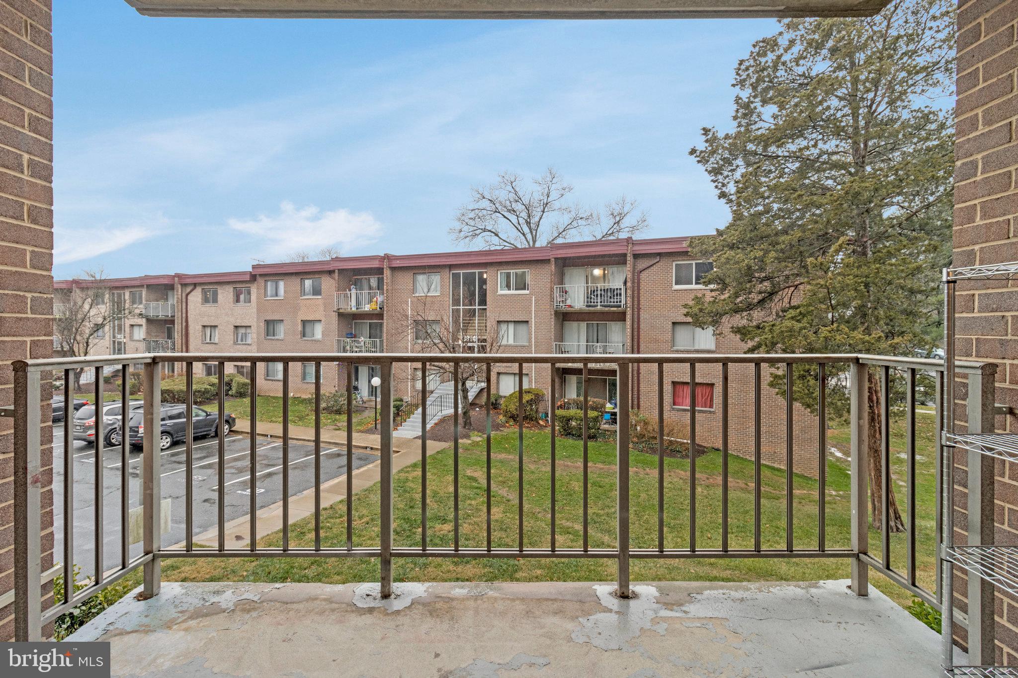 3802 Bel Pre Road, Unit 38025 Silver Spring, MD 20906 - Photo 36 of 36 a view of a brick house with a backyard
