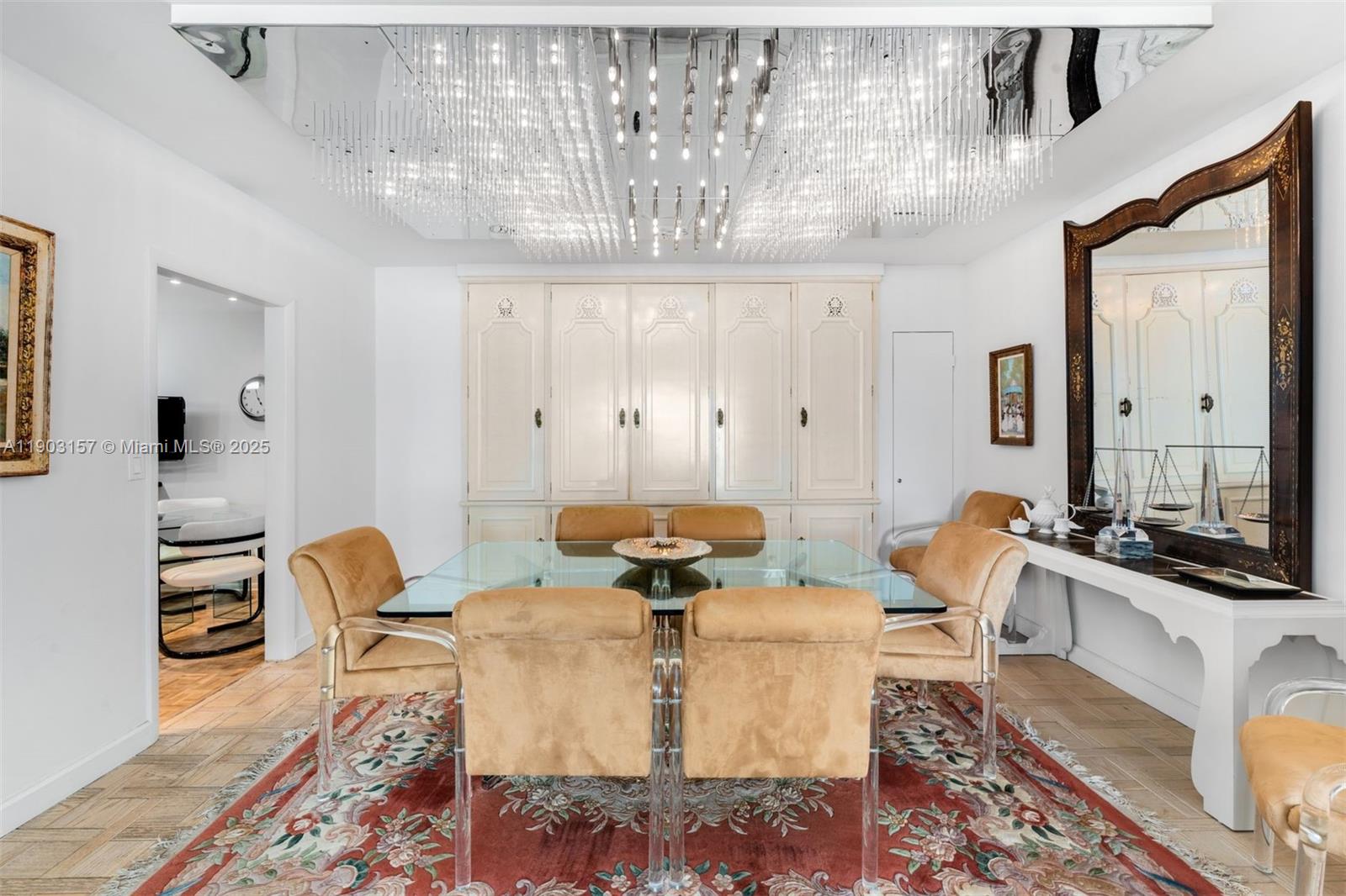 10155 Collins Avenue, Unit 307 Bal Harbour, FL 33154 - Photo 4 of 18 a living room with fireplace furniture and a chandelier