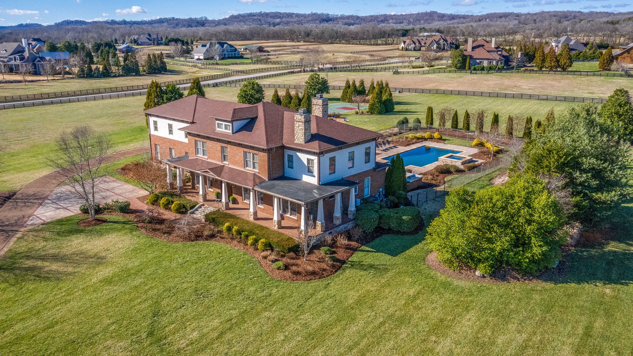 4205 Two Rivers Lane Franklin, TN 37069 - Photo 2 of 46 an aerial view of a house with a garden and lake view
