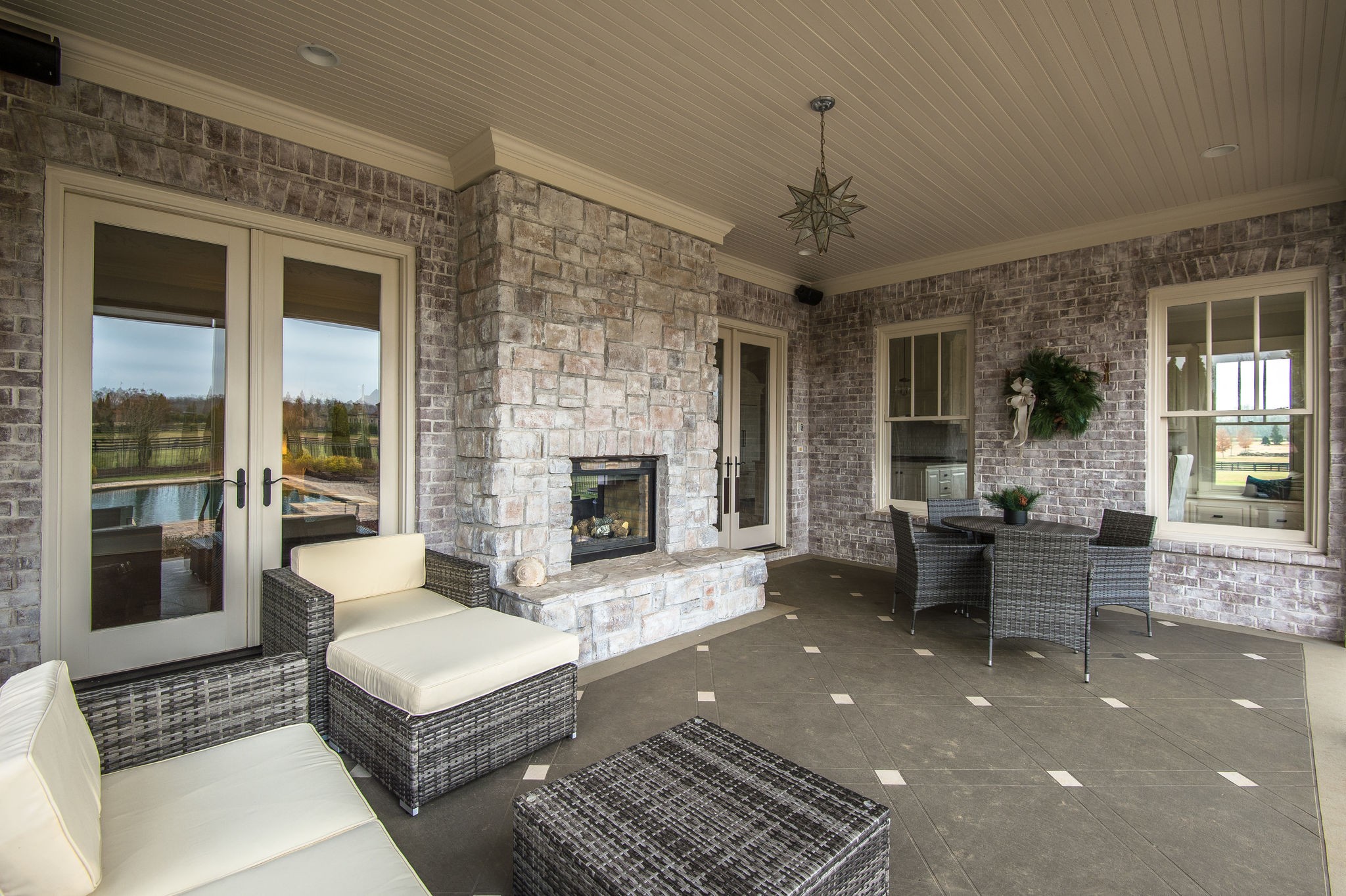 4205 Two Rivers Lane Franklin, TN 37069 - Photo 12 of 46 a living room with furniture a fireplace and a chandelier