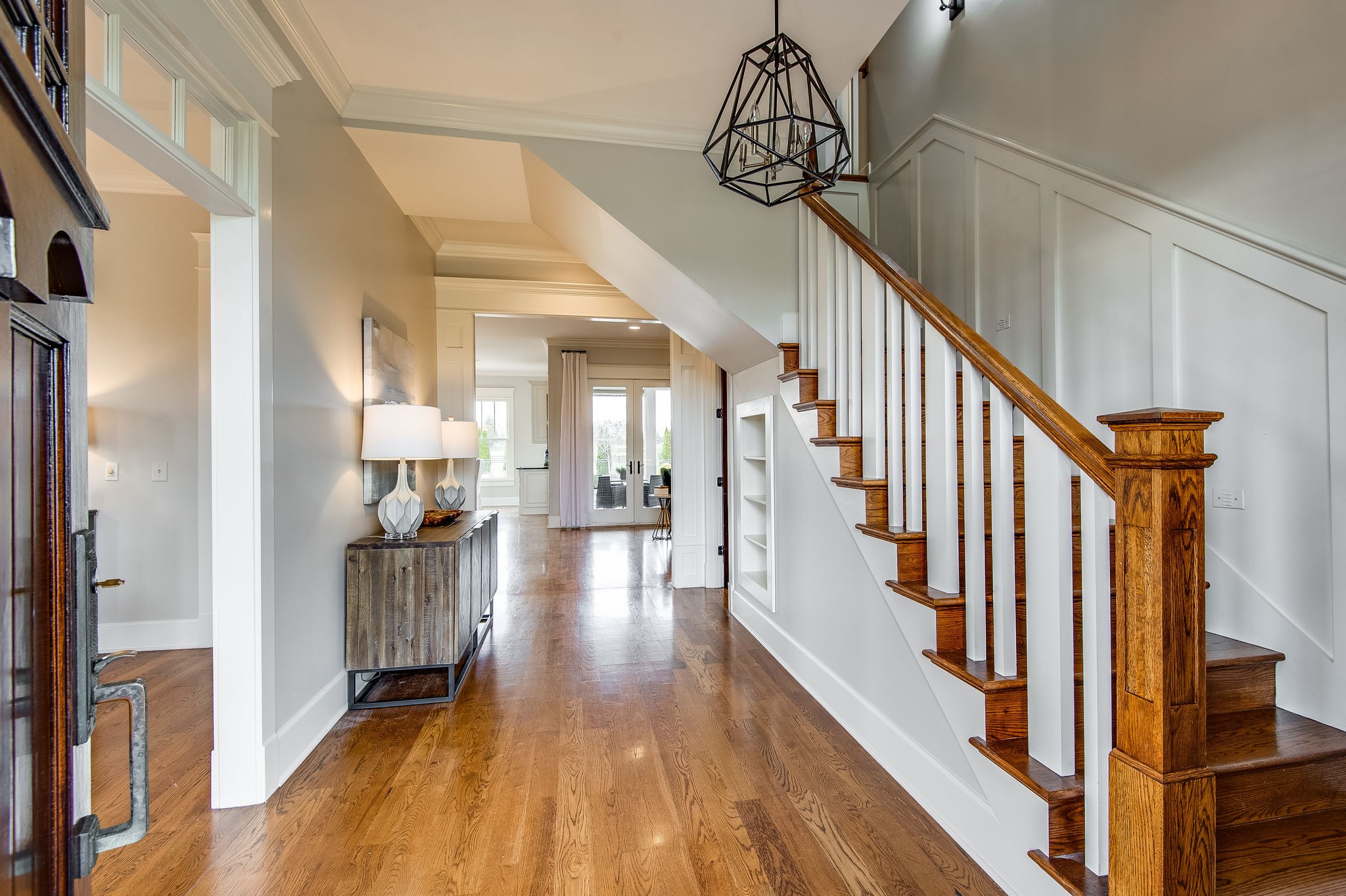 4205 Two Rivers Lane Franklin, TN 37069 - Photo 13 of 46 a view of a hallway with wooden floor and staircase