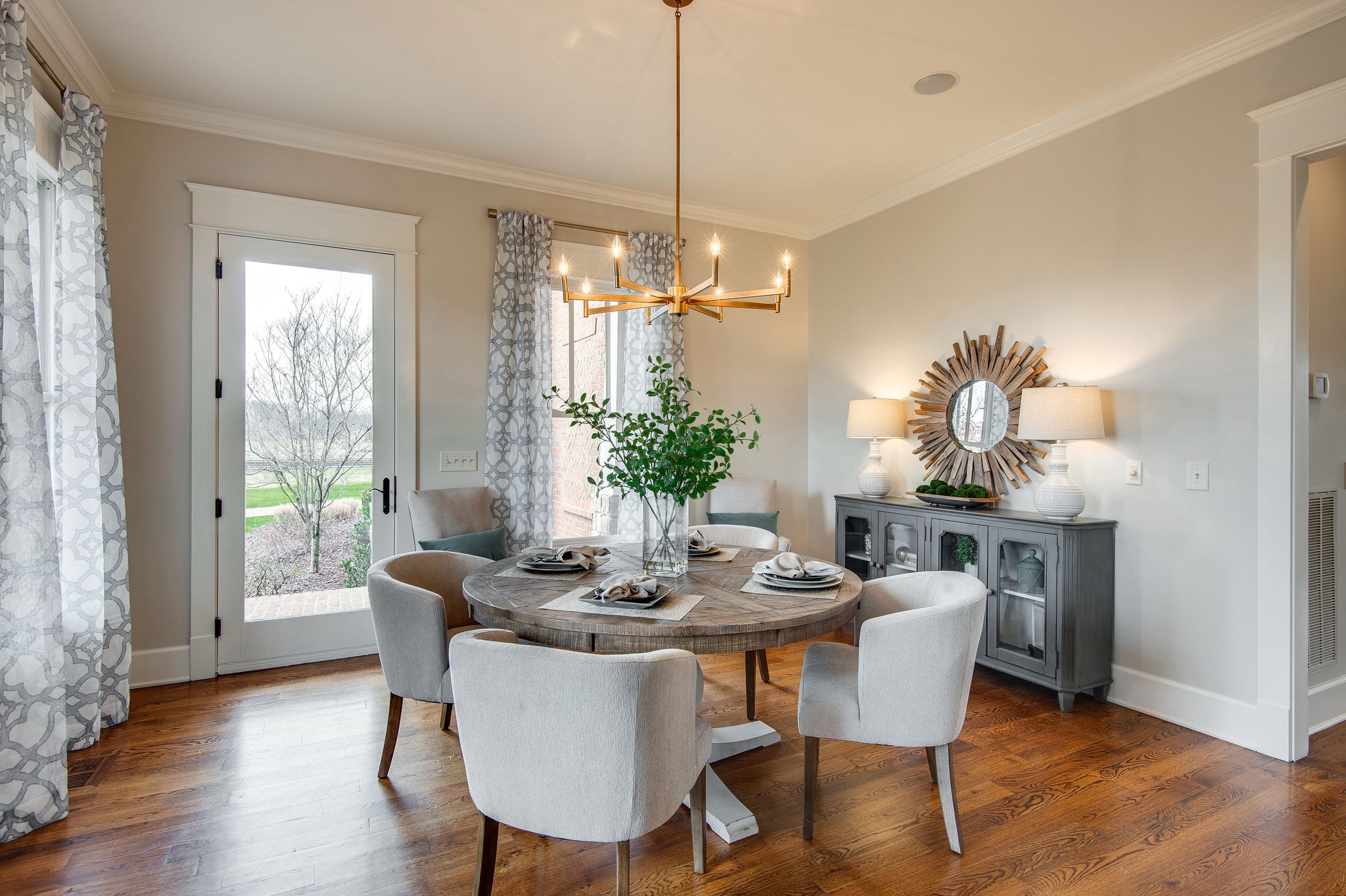 4205 Two Rivers Lane Franklin, TN 37069 - Photo 14 of 46 a dining room with furniture a chandelier and wooden floor