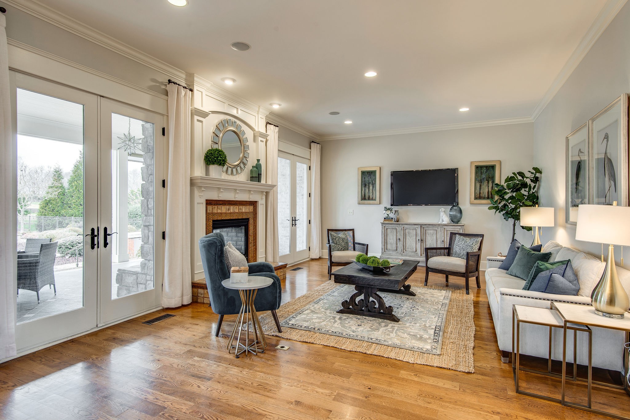 4205 Two Rivers Lane Franklin, TN 37069 - Photo 15 of 46 a living room with furniture a fireplace and a flat screen tv
