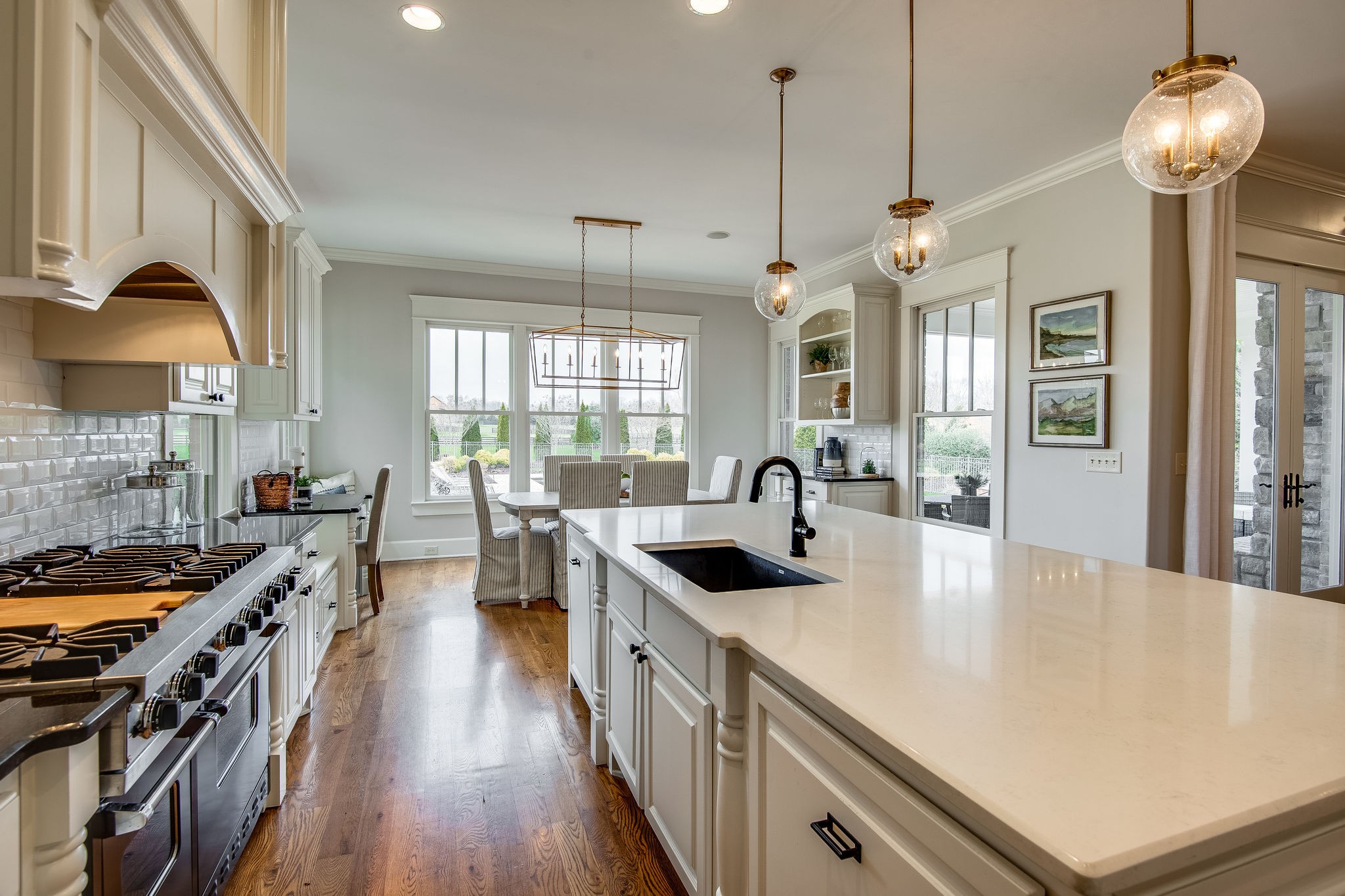 4205 Two Rivers Lane Franklin, TN 37069 - Photo 18 of 46 a kitchen with stainless steel appliances a stove a sink a counter space and wooden floor