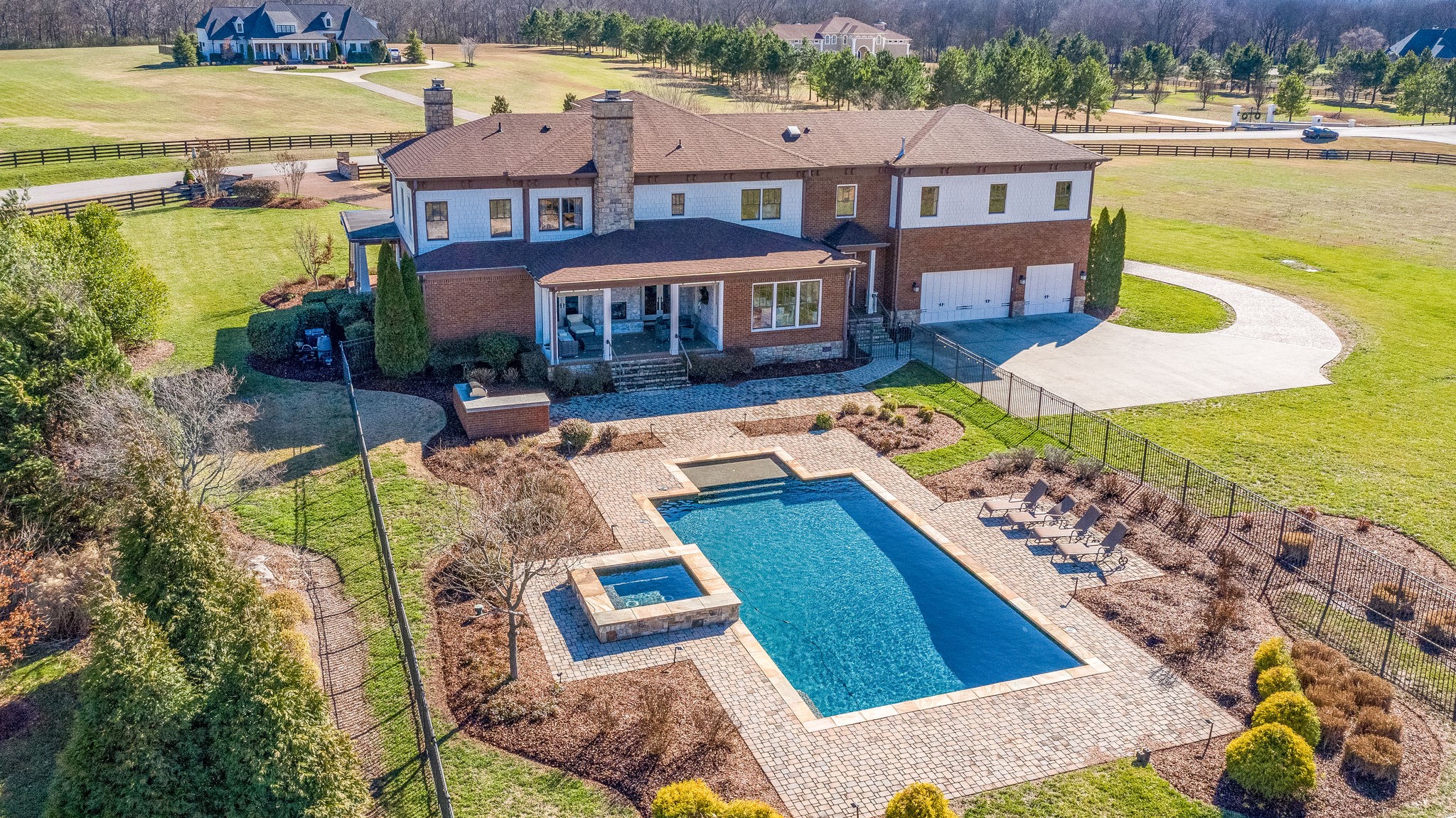 4205 Two Rivers Lane Franklin, TN 37069 - Photo 3 of 46 a view of a swimming pool with a lounge chairs