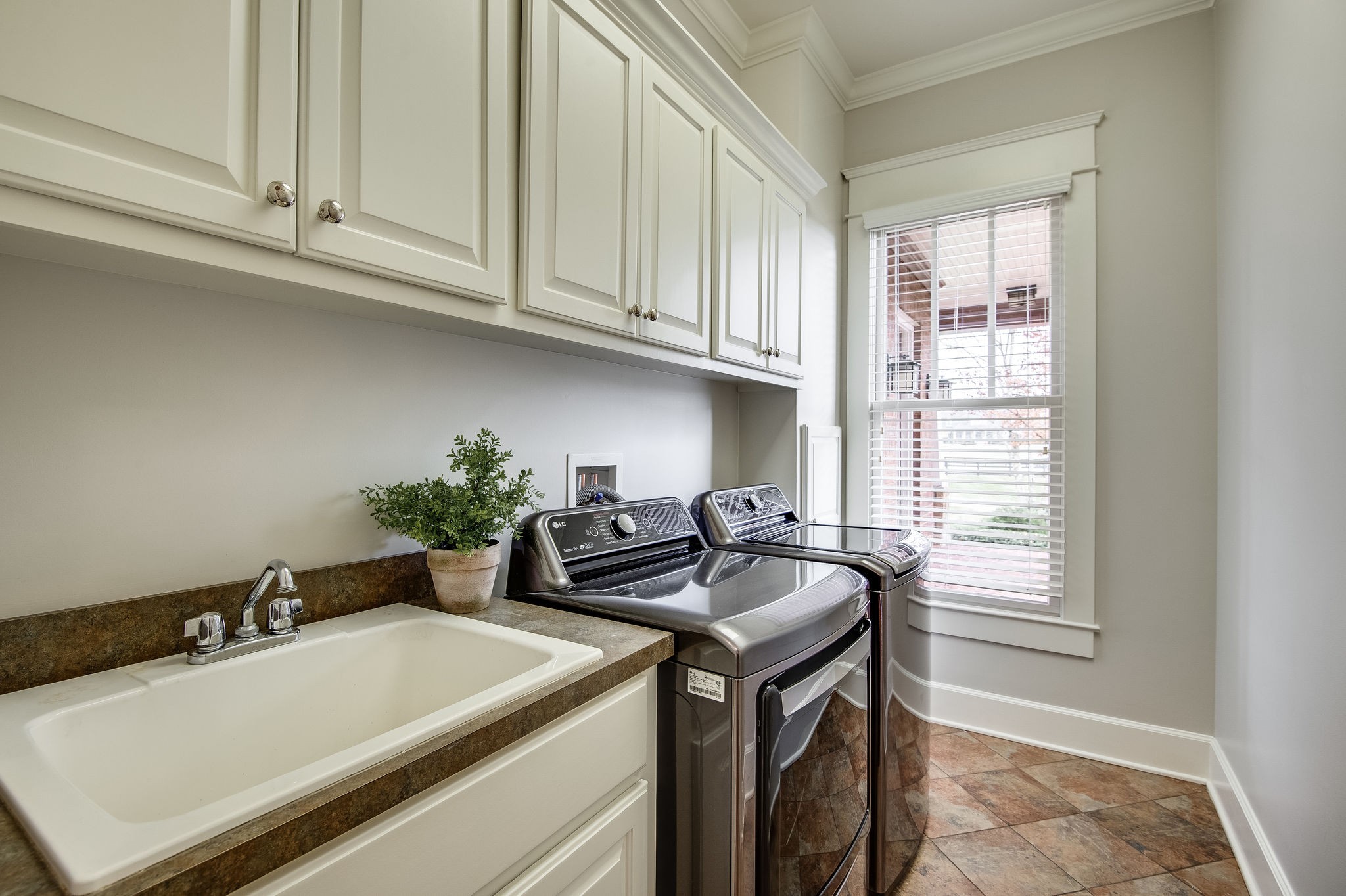 4205 Two Rivers Lane Franklin, TN 37069 - Photo 22 of 46 a kitchen with stainless steel appliances granite countertop a sink stove and cabinets