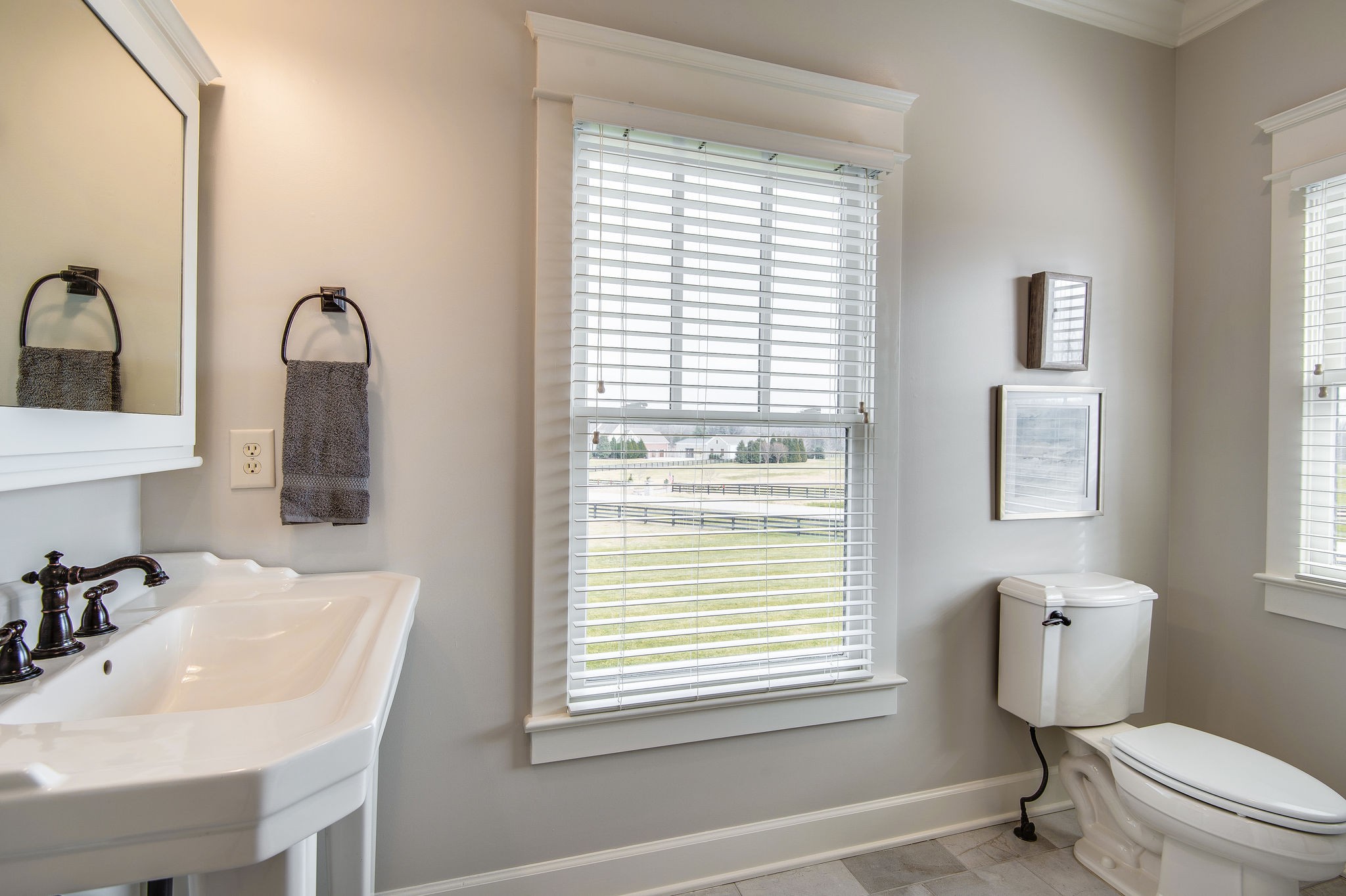 4205 Two Rivers Lane Franklin, TN 37069 - Photo 35 of 46 a bathroom with a toilet sink vanity and mirror