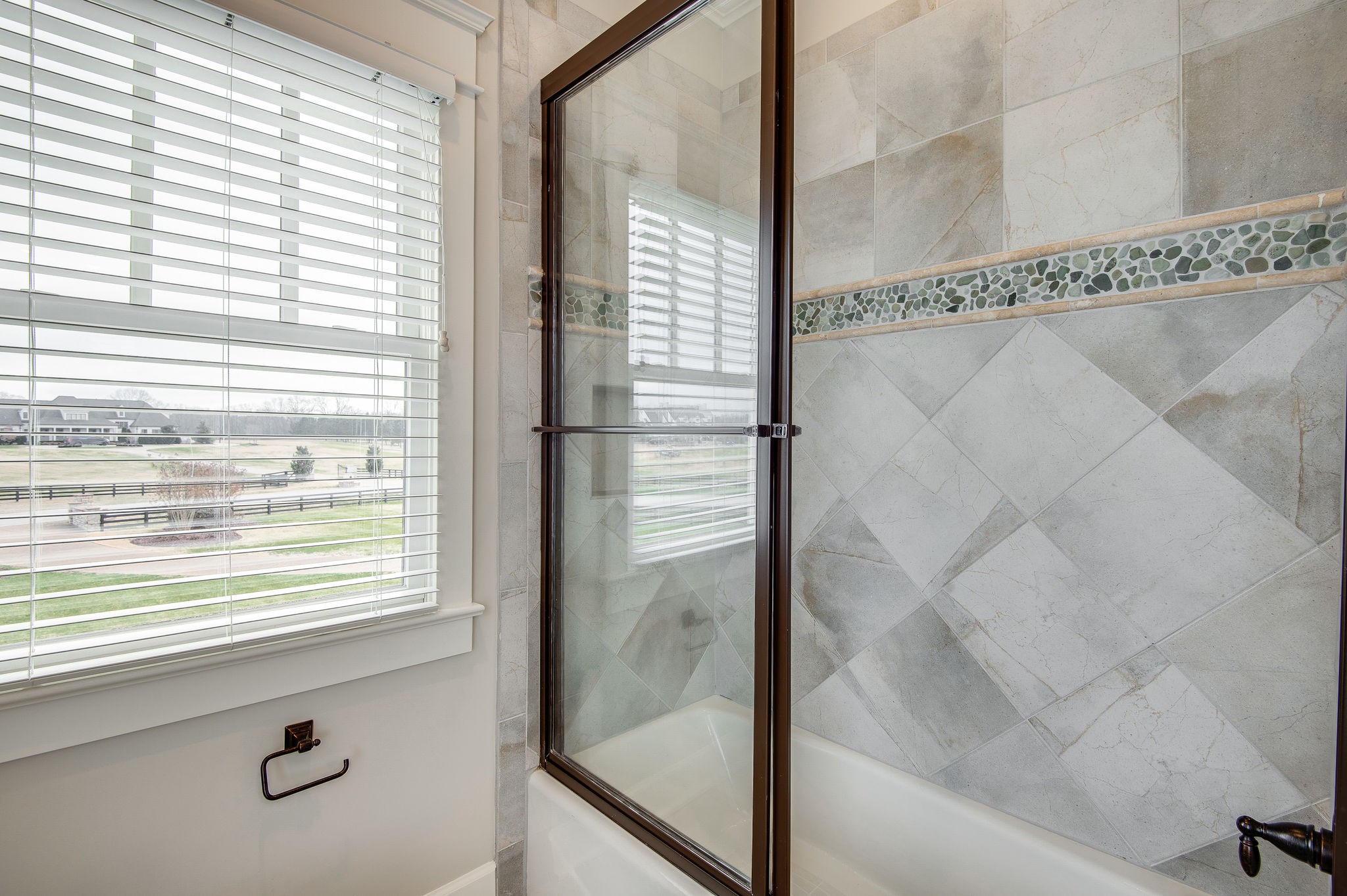 4205 Two Rivers Lane Franklin, TN 37069 - Photo 36 of 46 a bathroom with a glass shower door