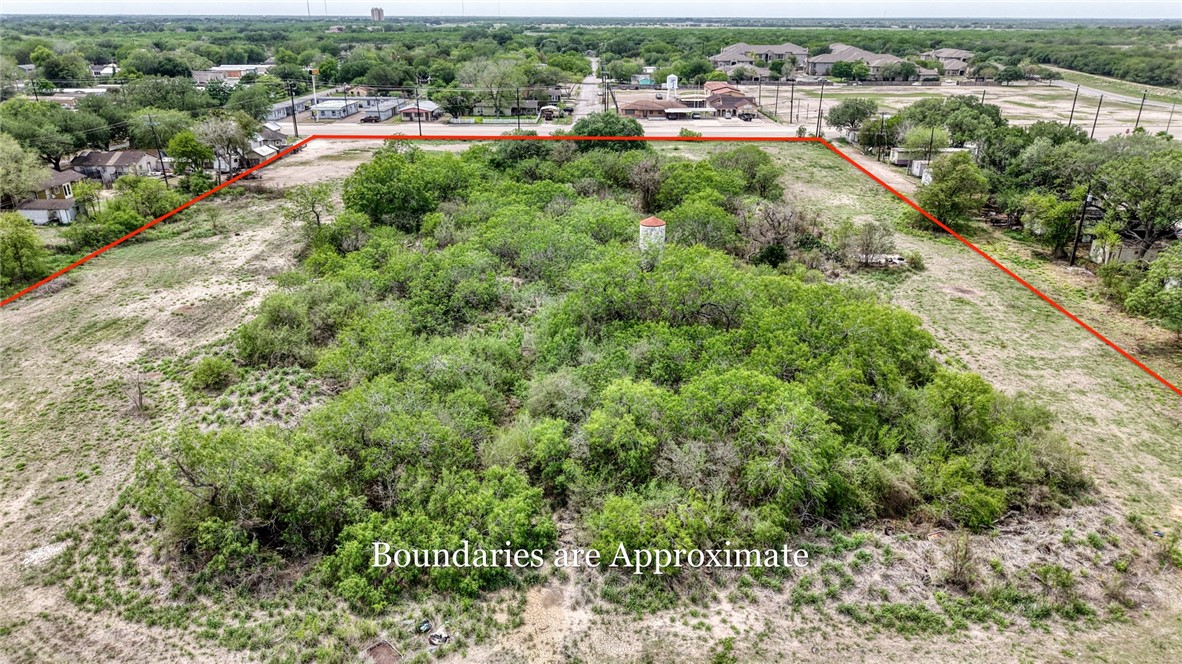 900 North Johnson Street Alice, TX 78332 - Photo 12 of 37 an aerial view of residential houses with outdoor space and trees all around
