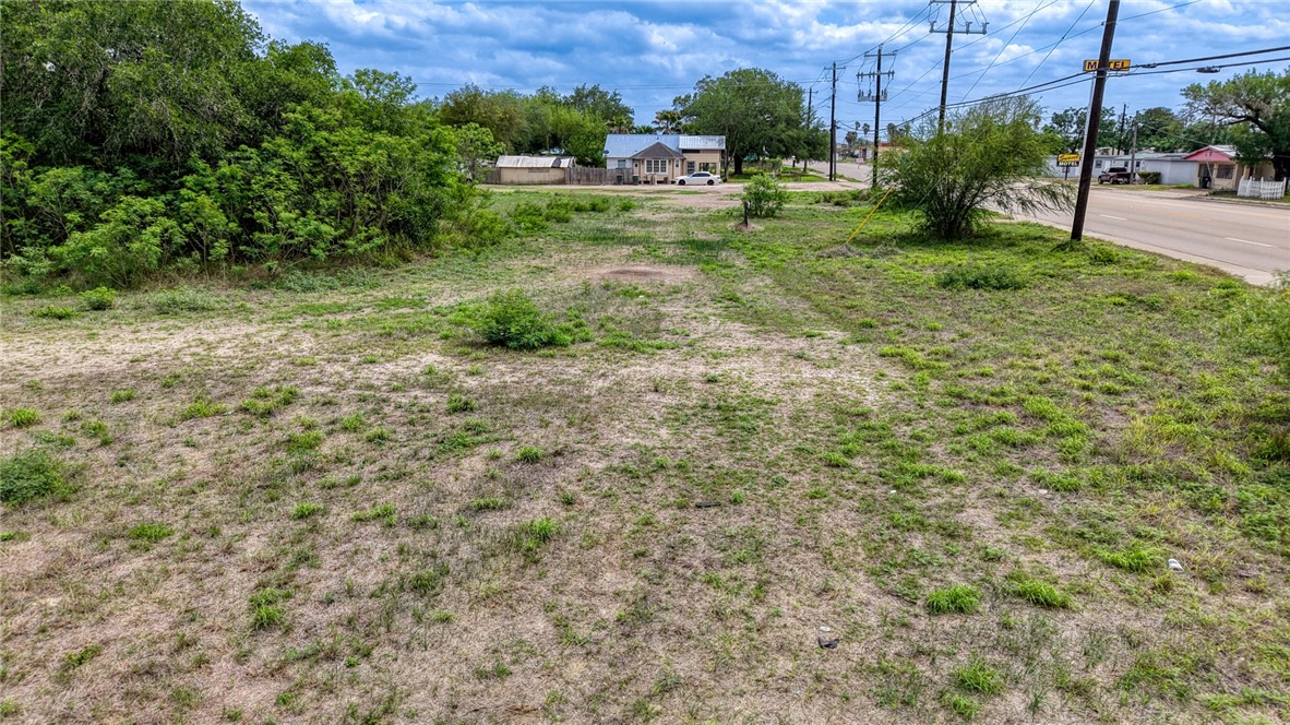 900 North Johnson Street Alice, TX 78332 - Photo 15 of 37 a view of a yard with plants and a bench