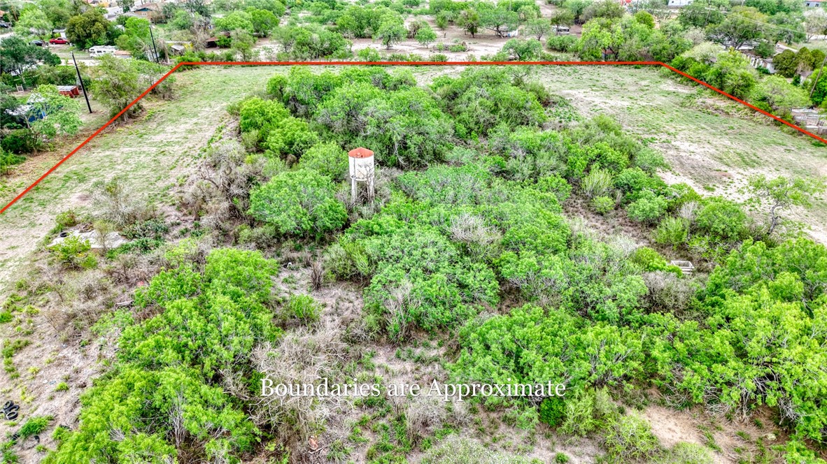 900 North Johnson Street Alice, TX 78332 - Photo 32 of 37 an aerial view of residential house with outdoor space and trees all around