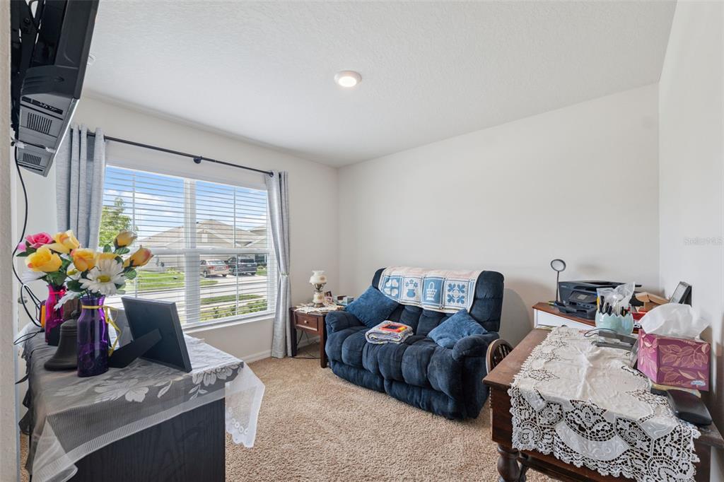 13196 Golden Lime Ave Spring Hill Spring Hill, FL 34609 - Photo 15 of 73 a living room with furniture and a window
