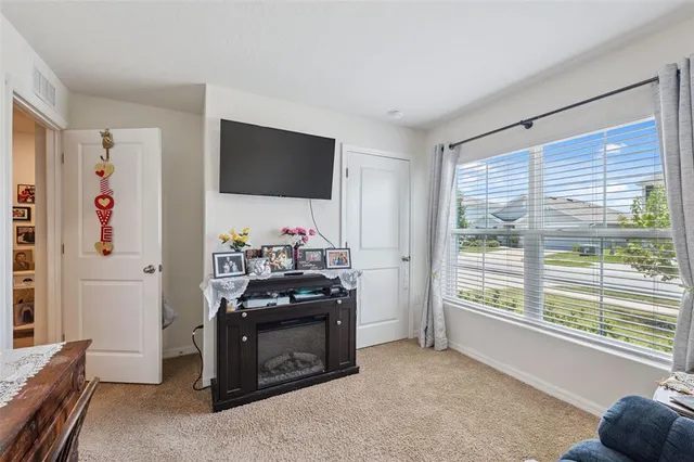 a bedroom with a bed and a cabinets