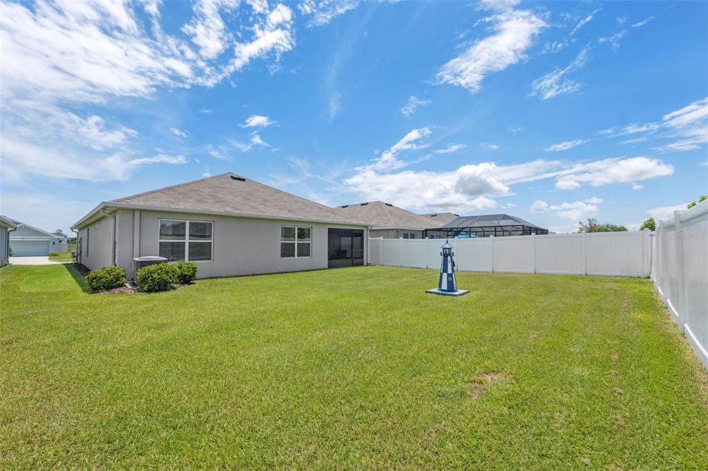 13196 Golden Lime Ave Spring Hill Spring Hill, FL 34609 - Photo 28 of 73 a front view of a house with a garden