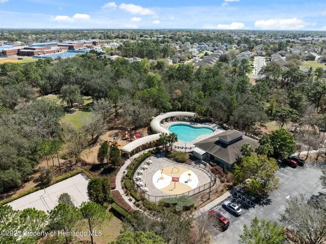 a living room with furniture and a piano