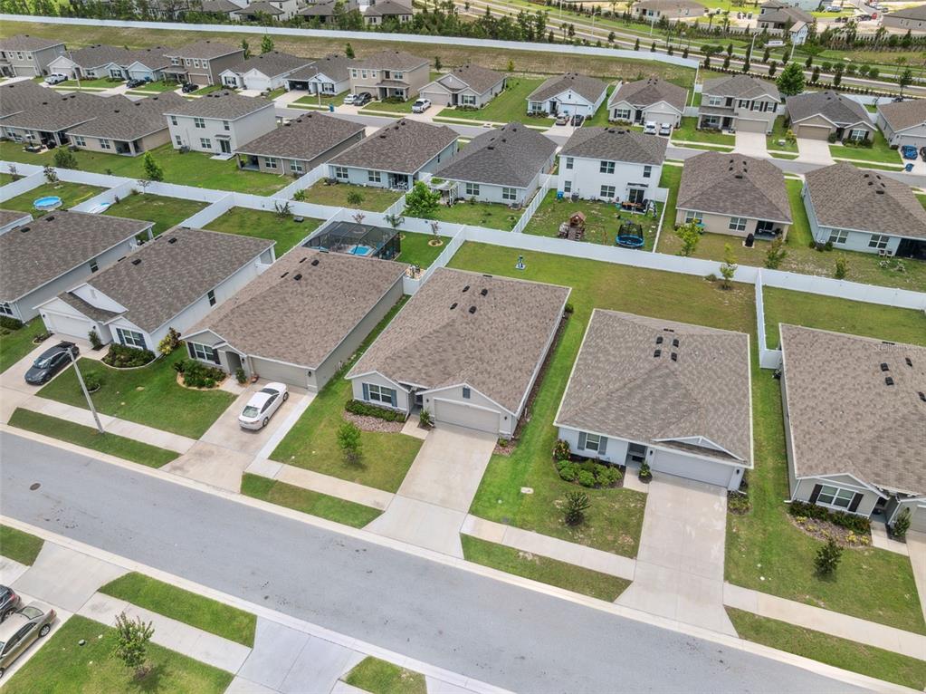 13196 Golden Lime Ave Spring Hill Spring Hill, FL 34609 - Photo 63 of 73 an aerial view of residential houses with outdoor space and parking