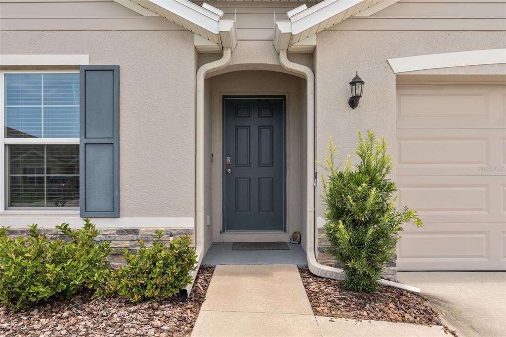 13196 Golden Lime Ave Spring Hill Spring Hill, FL 34609 - Photo 8 of 73 a front view of a house with a yard
