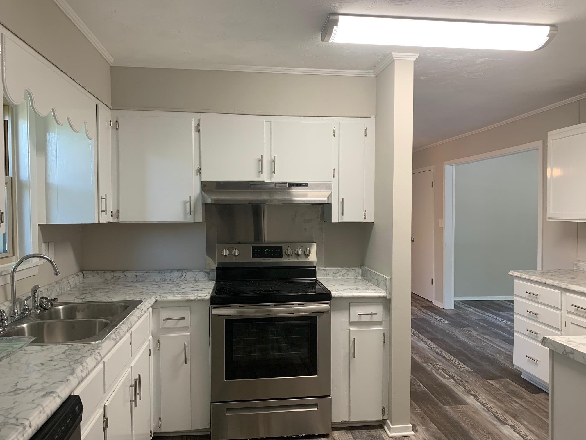 334 Sherrin Drive Ripley, TN 38063 - Photo 9 of 19 a kitchen with a stove and a sink