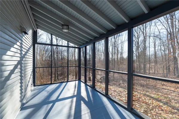 a view of balcony with wooden floor