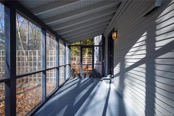 a view of a balcony with wooden floor