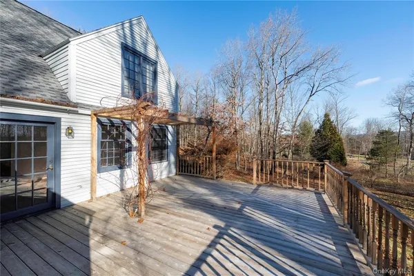 a view of a house with wooden deck