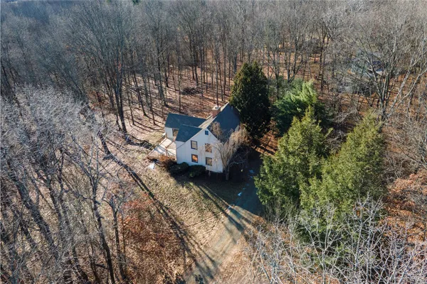 a aerial view of a house with a yard