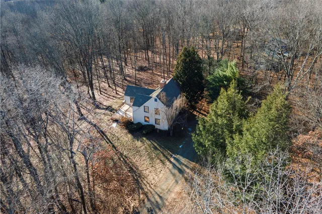 a aerial view of a house with a yard