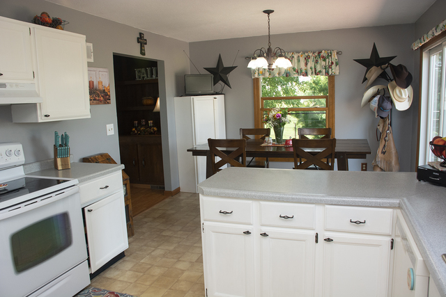 15755 Hillside Road Morrison, IL 61270 - Photo 9 of 26 a kitchen with appliances cabinets and a table