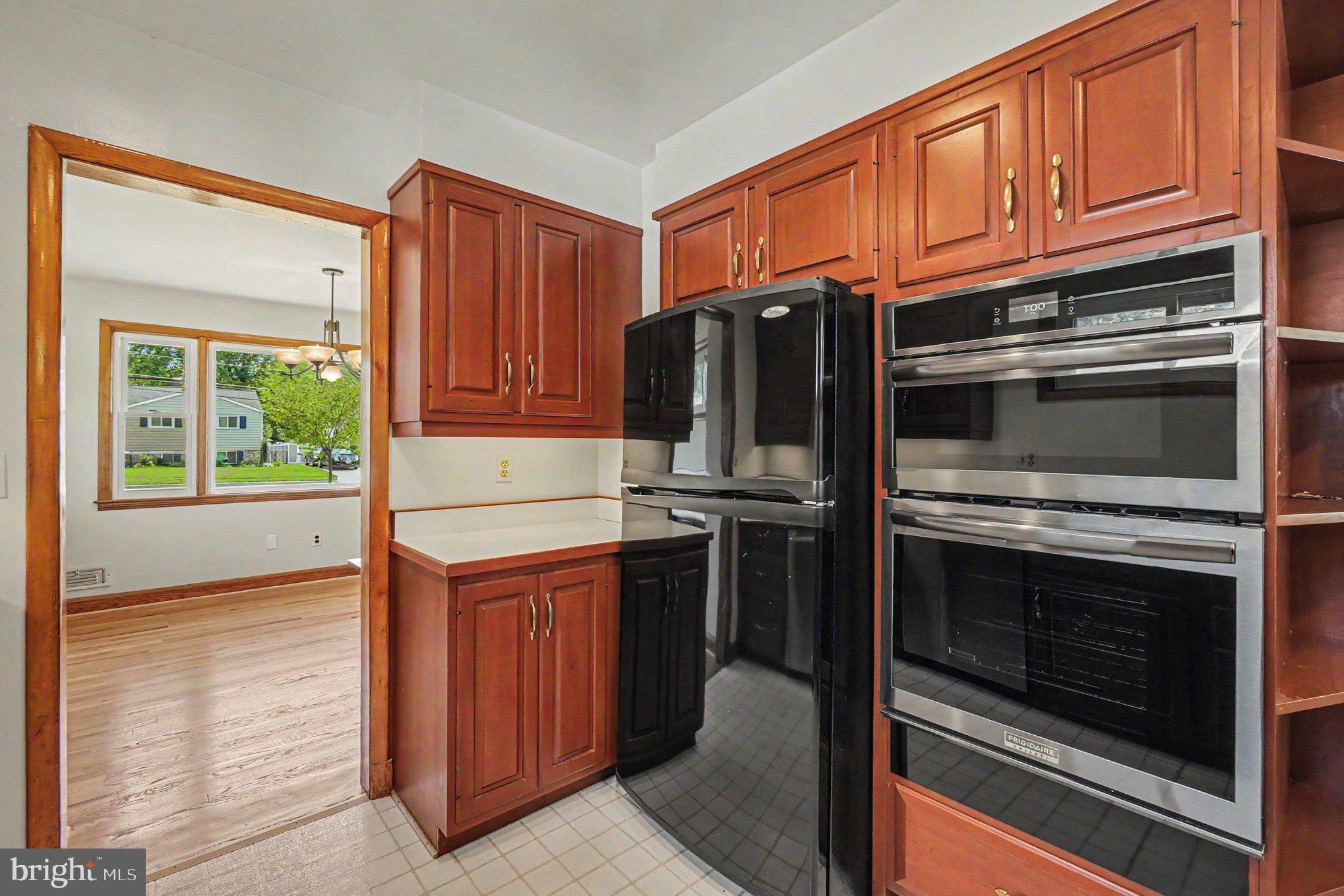 9204 Snyder Lane Perry Hall, MD 21128 - Photo 11 of 42 a kitchen with stainless steel appliances granite countertop a stove microwave and refrigerator