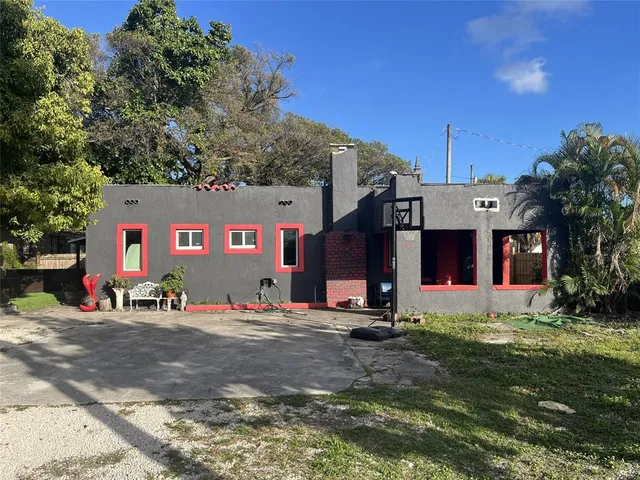 a row of table and chairs in front of a house