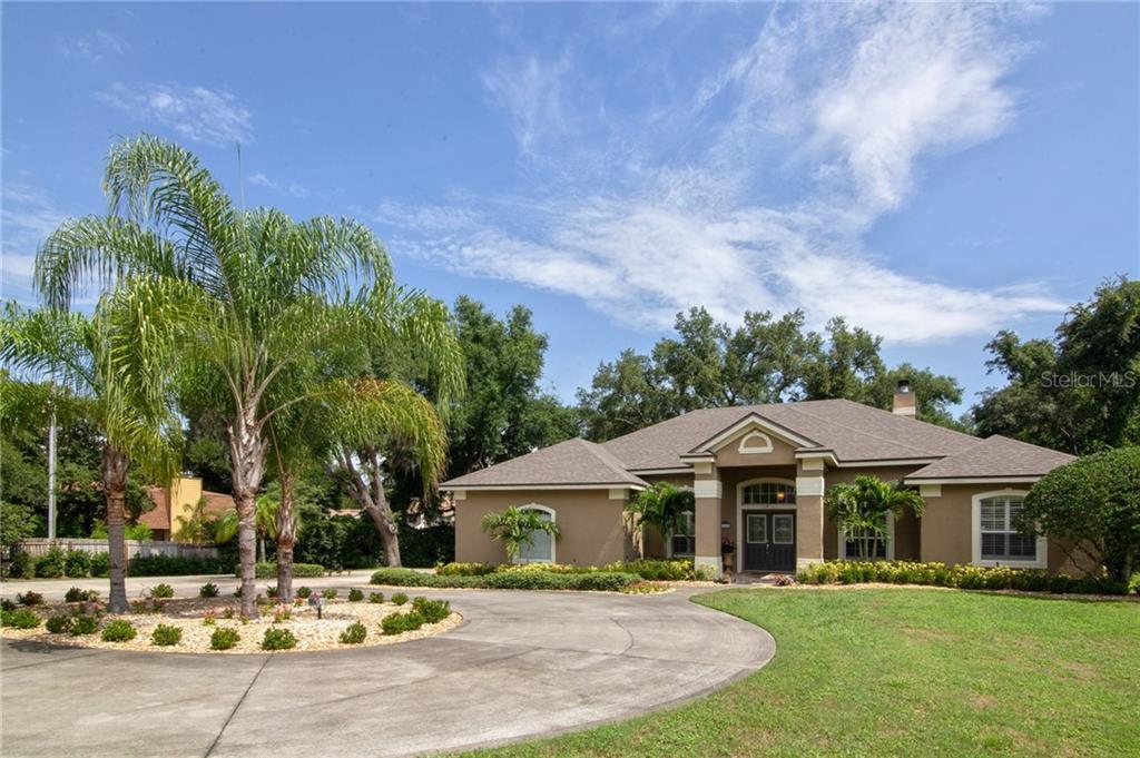9953 White Road Ocoee, FL 34761 - Photo 1 of 1 Large circular driveway with extra parking pad on side of home next to garage and .61 acres!