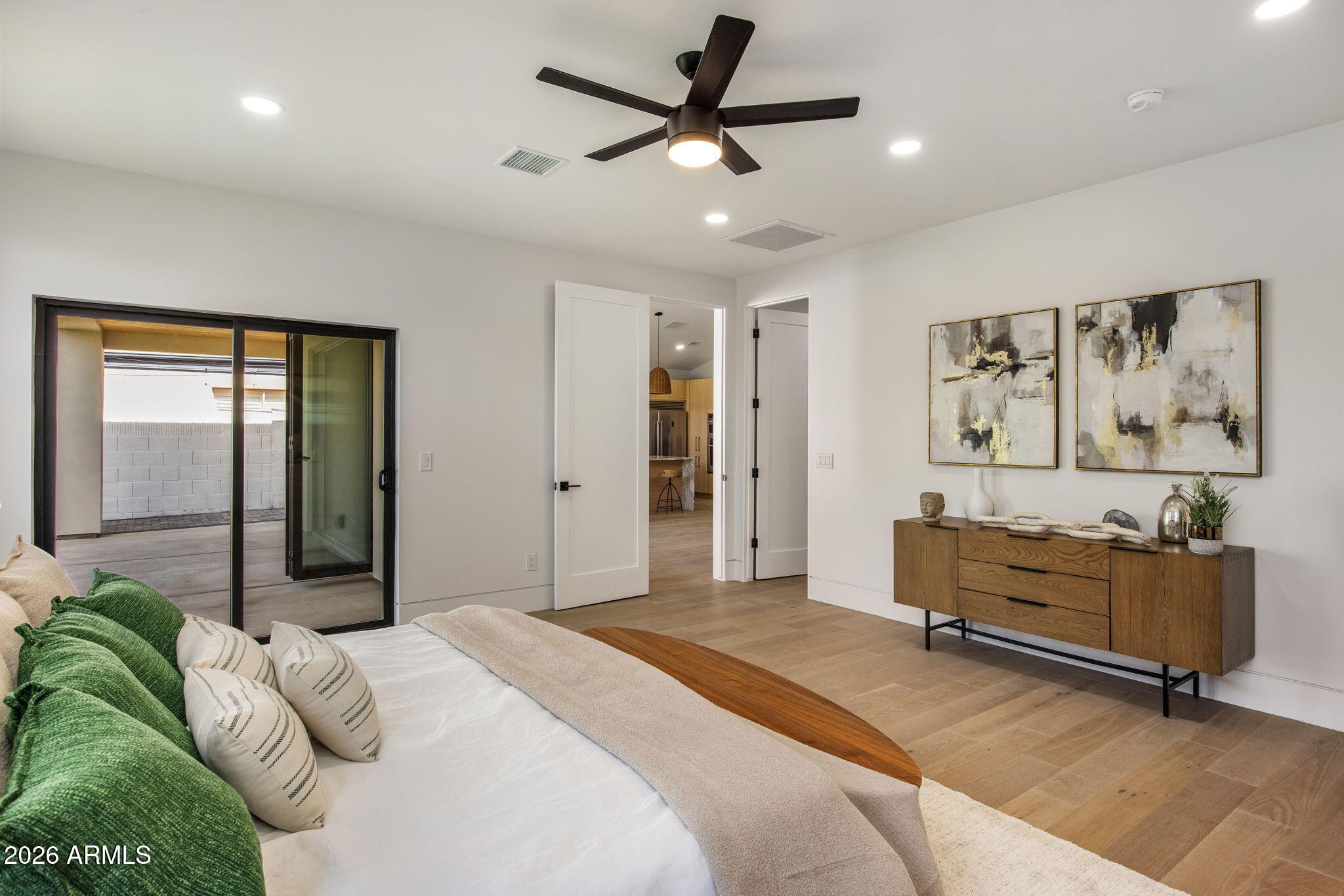 4224 North 35th Place Phoenix, AZ 85018 - Photo 12 of 24 a bedroom with a bed and a chandelier