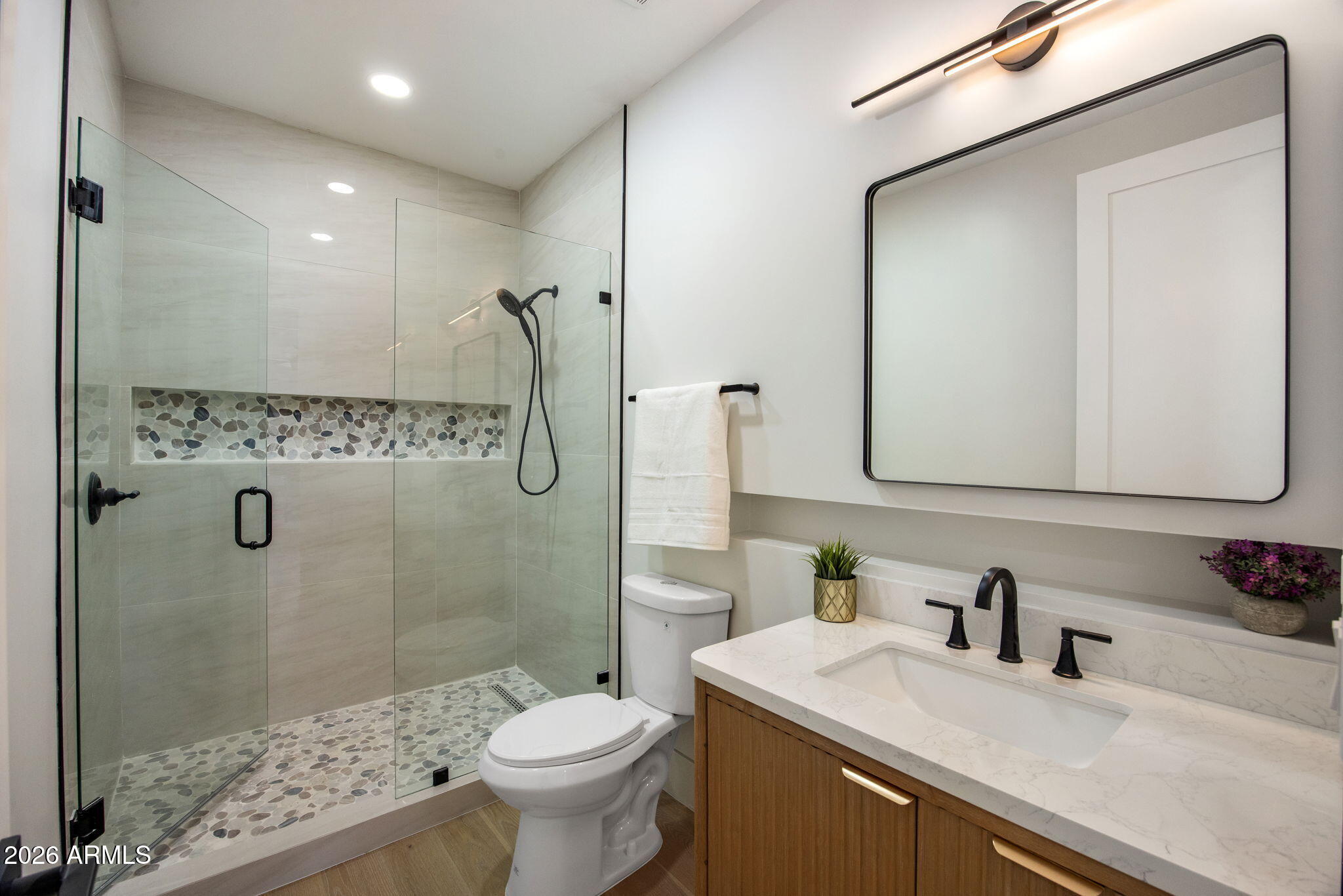 4224 North 35th Place Phoenix, AZ 85018 - Photo 19 of 24 a bathroom with a sink toilet and shower