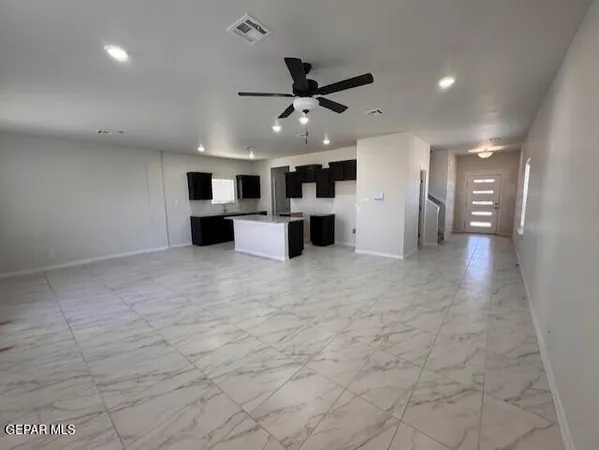 a view of a kitchen with a sink and a window