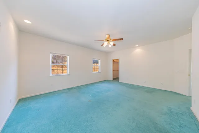a white bath tub sitting next to a window