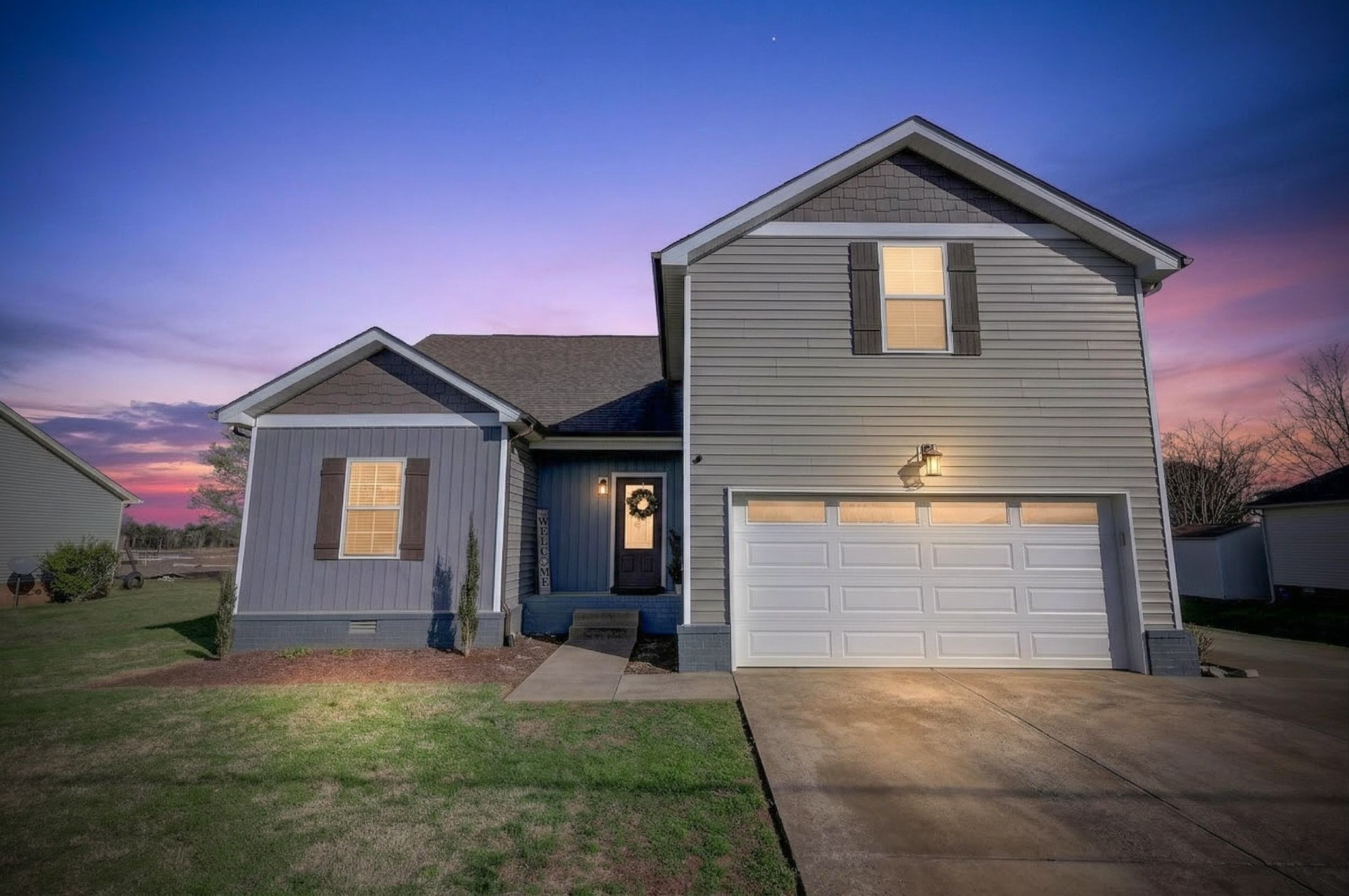 1319 Dodd Trail Murfreesboro, TN 37128 - Photo 2 of 23 a front view of a house with a yard and garage