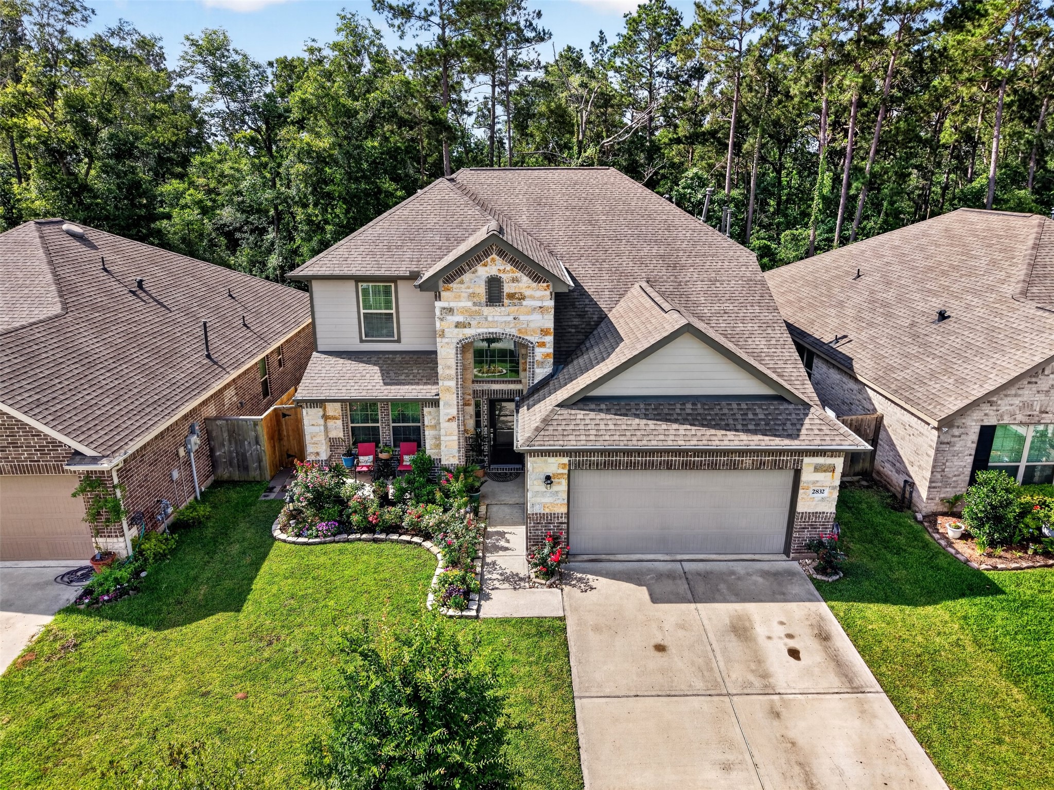 2832 Mistygate Court Conroe, TX 77301 - Photo 41 of 50 Aerial front exterior view of t.he home and wonderful landscaping.