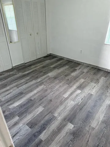 a view of a yard with a table and chairs