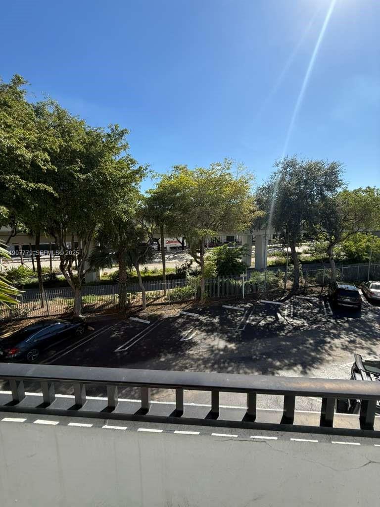 2498 Southwest 17th Avenue, Unit 4311 Miami, FL 33133 - Photo 15 of 15 a view of a yard with a table and chairs