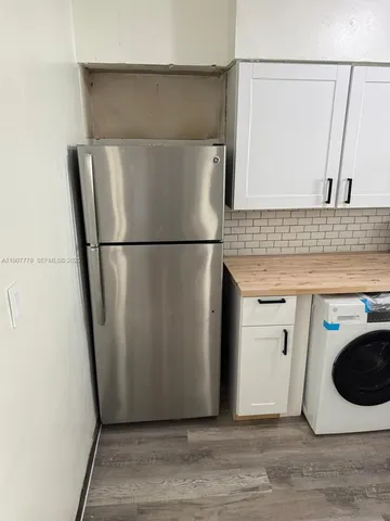 a utility room with washer and dryer