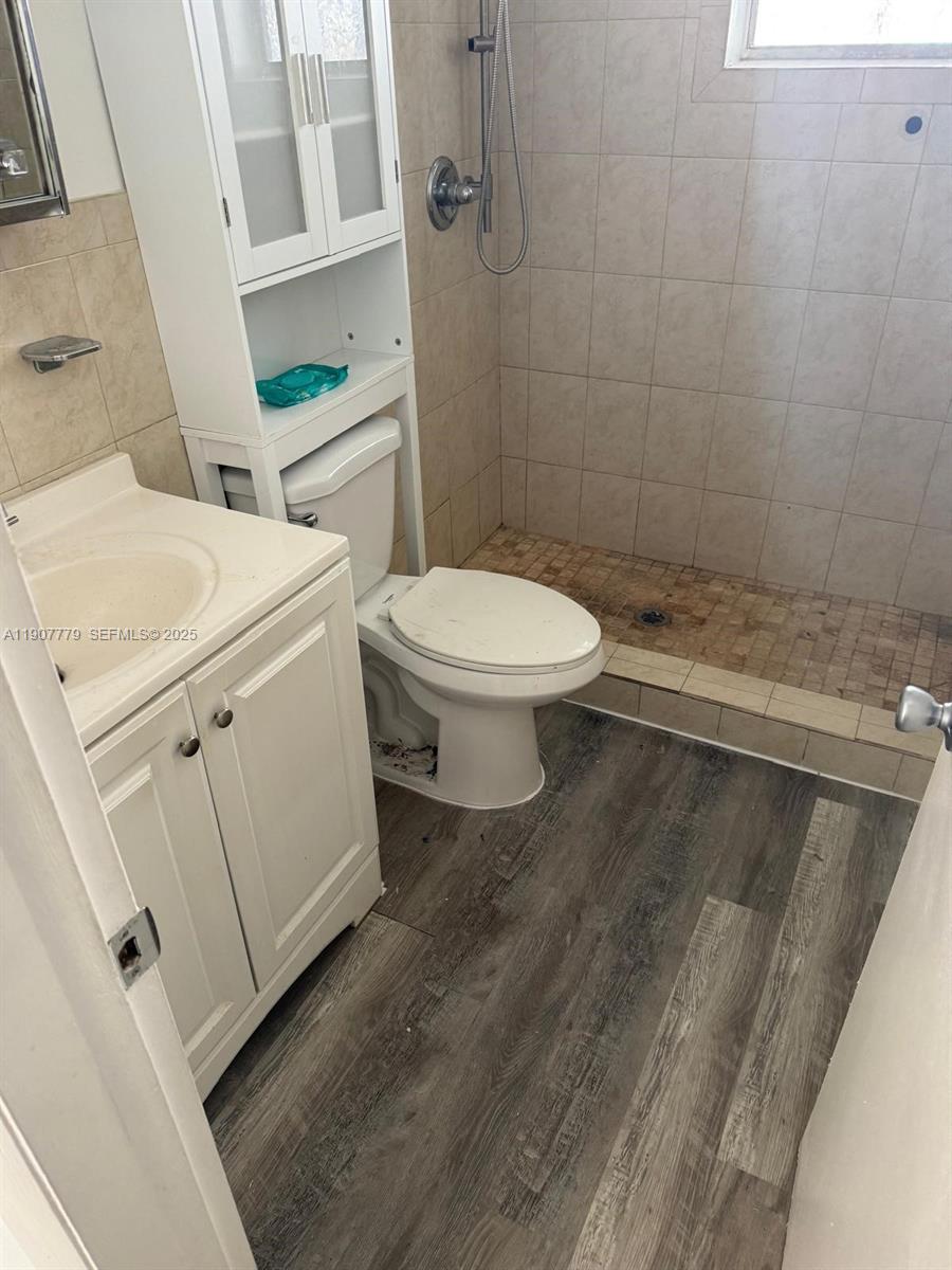 2498 Southwest 17th Avenue, Unit 4311 Miami, FL 33133 - Photo 10 of 15 a bathroom with a toilet and a shower