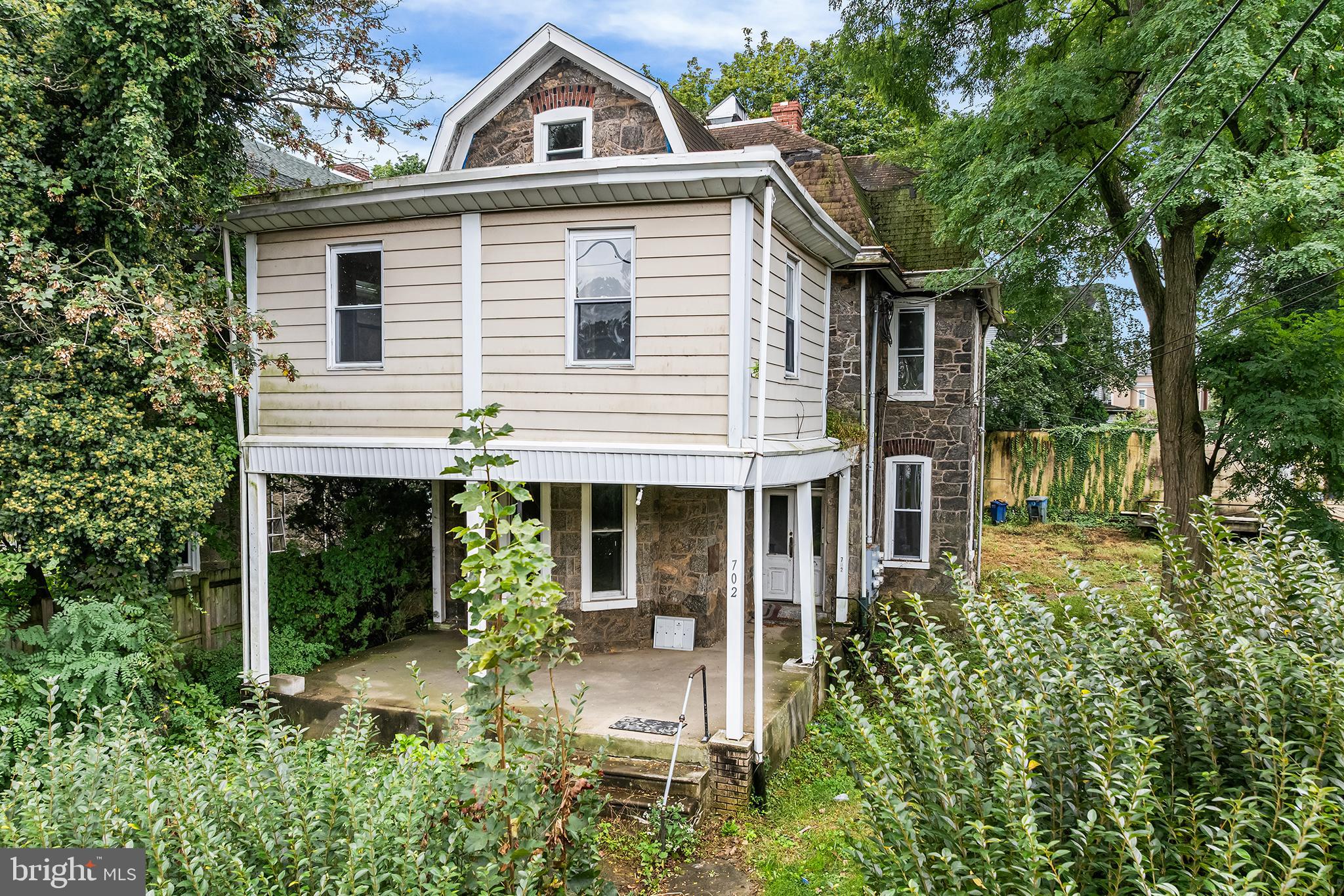 702 Oak Lane Philadelphia, PA 19126 - Photo 11 of 19 a front view of a house with a yard