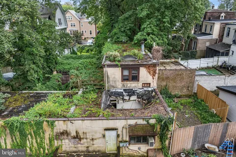 an aerial view of a house with outdoor space