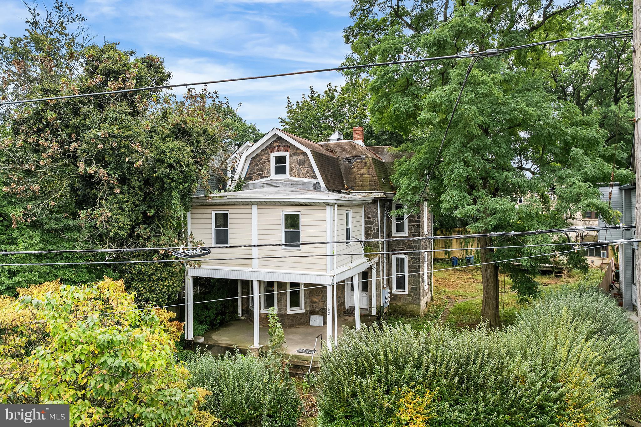 702 Oak Lane Philadelphia, PA 19126 - Photo 2 of 19 a aerial view of a house with a yard table and chairs
