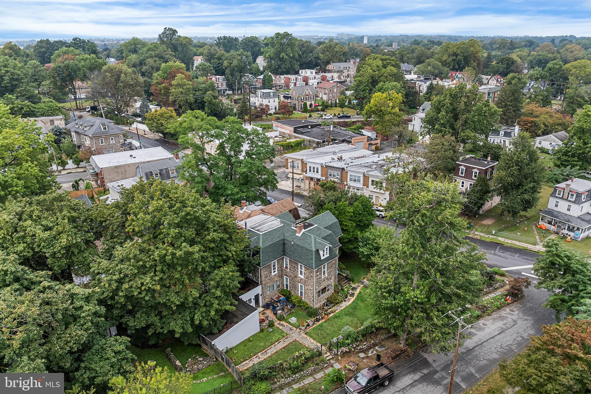 702 Oak Lane Philadelphia, PA 19126 - Photo 4 of 19 an aerial view of residential house with outdoor space and trees all around