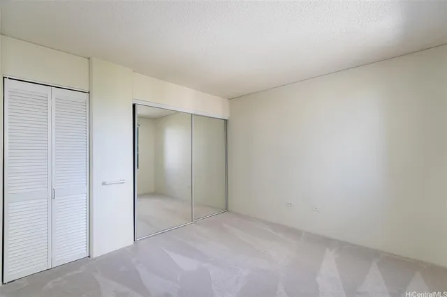 a living room with furniture and large windows