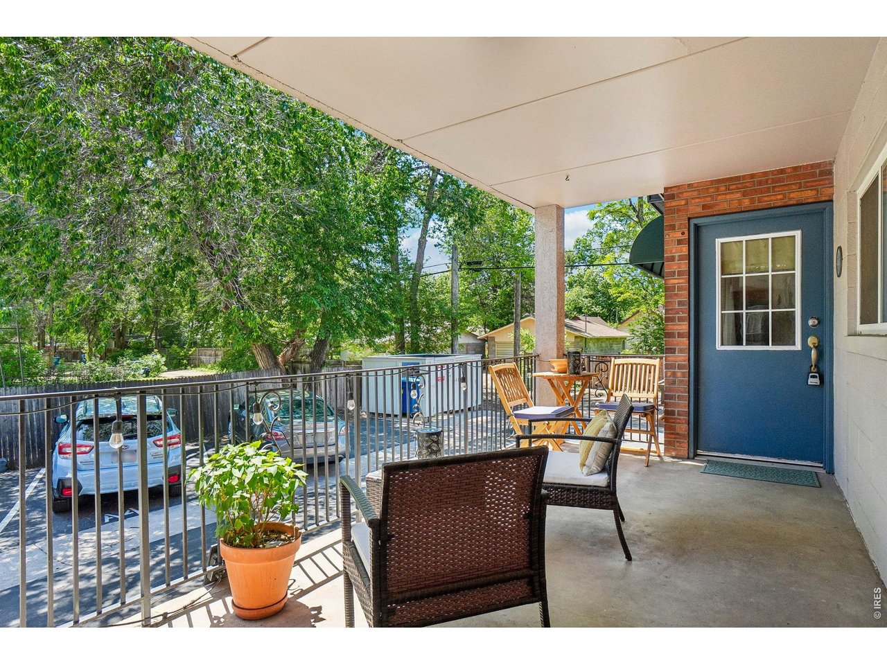 233 North Meldrum Street, Unit 4 Fort Collins, CO 80521 - Photo 3 of 16 a view of a patio with a table chairs and a potted plants