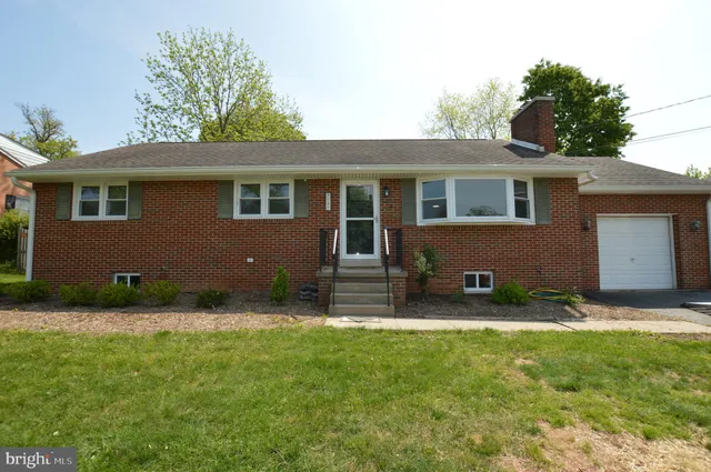 a view of house with garage