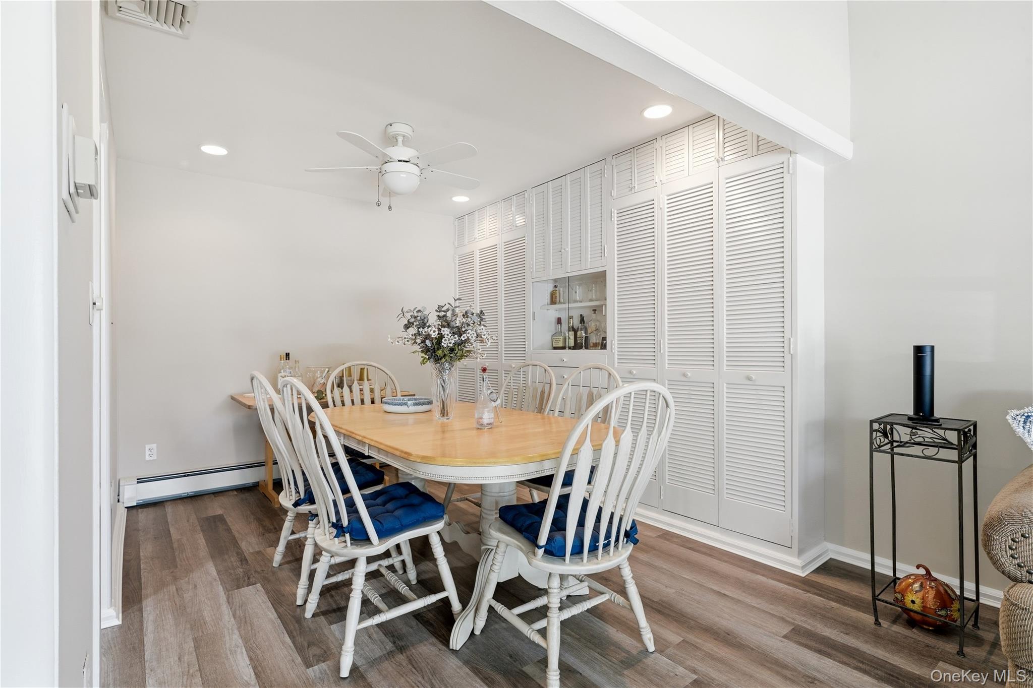 1853 Decatur Avenue Merrick, NY 11566 - Photo 10 of 43 a view of a dining room with furniture and wooden floor