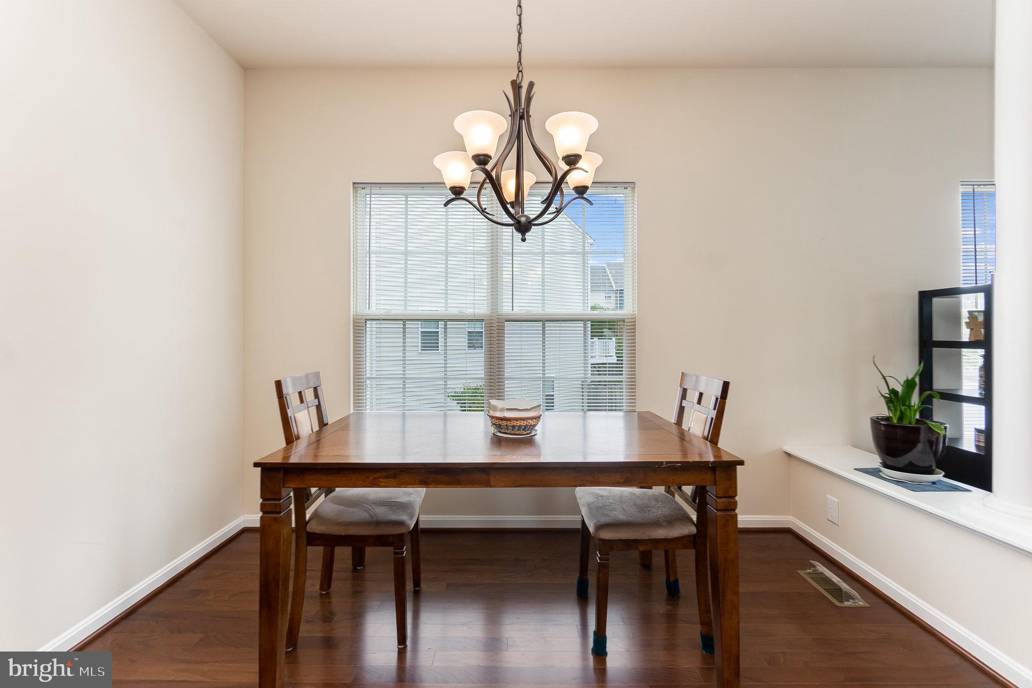 4711 Wensel Road Fredericksburg, VA 22408 - Photo 12 of 33 a view of a dining room with furniture and wooden floor